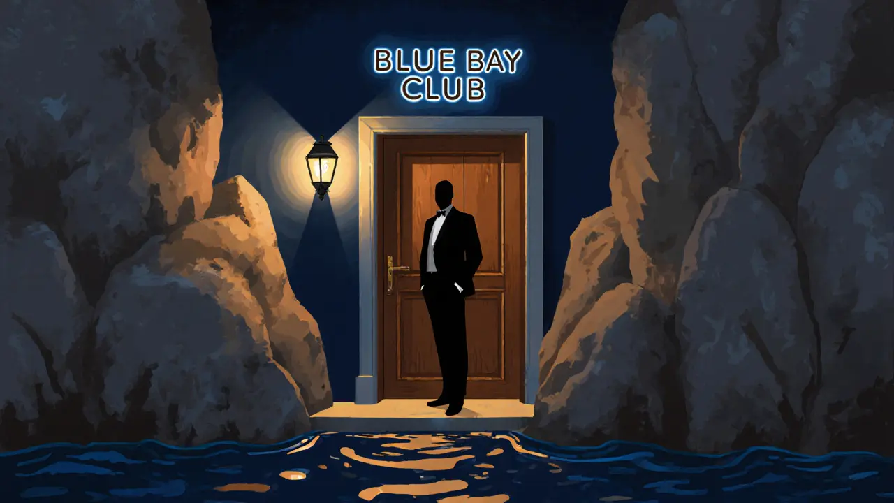 Hidden entrance to Blue Bay Club nestled among rocky cliffs with dim lighting.