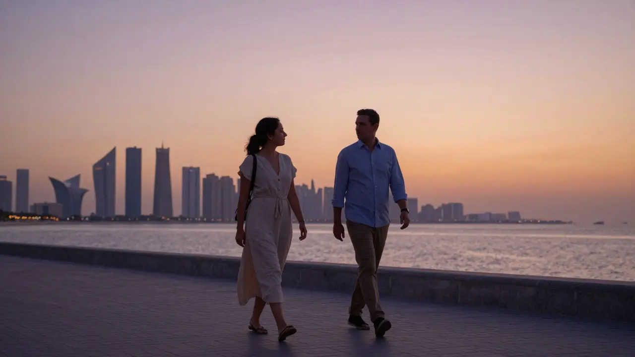 A couple walking along Abu Dhabi’s Corniche at sunset, engaged in quiet conversation under a golden sky.